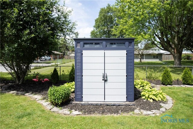 1118 5th St, Findlay, OH 45840 - view of shed featuring a fenced backyard