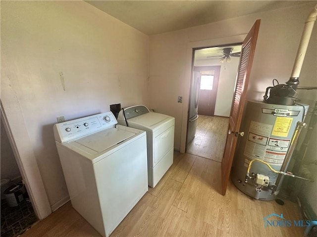 228 Harris St, Elmore, OH 43416 - laundry area with washing machine and clothes dryer, gas water heater, light wood finished floors, and ceiling fan