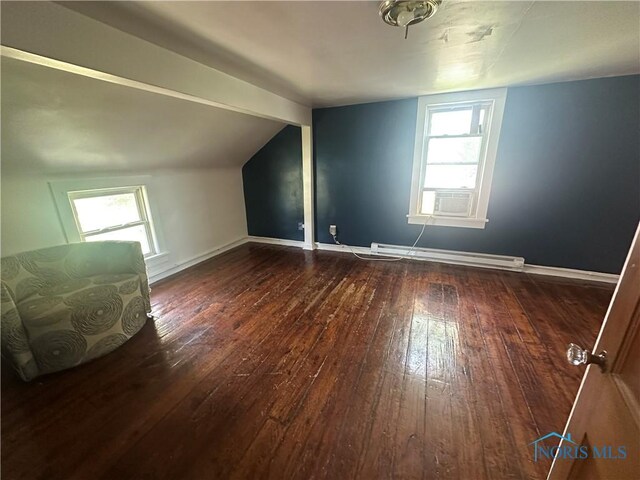 228 Harris St, Elmore, OH 43416 - bonus room featuring a baseboard heating unit, hardwood / wood-style floors, plenty of natural light, and lofted ceiling