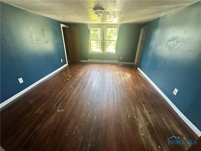 228 Harris St, Elmore, OH 43416 - spare room with a baseboard radiator and hardwood / wood-style flooring