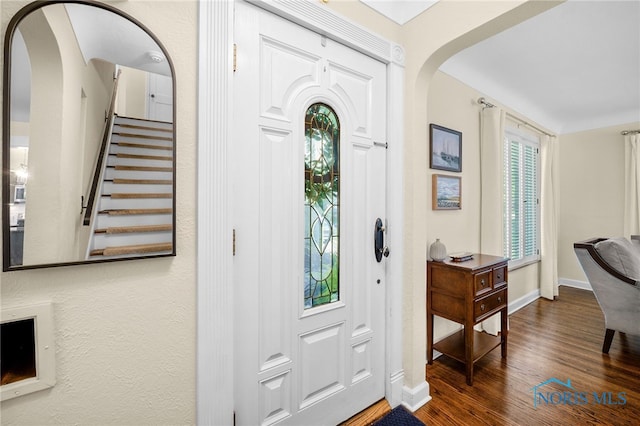 2230 Middlesex Dr, Toledo, OH 43606 - foyer entrance with stairway, wood finished floors, and arched walkways