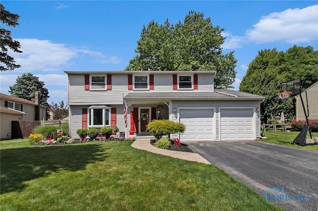 2204 Longport Dr, Maumee, OH 43537 - traditional-style house featuring asphalt driveway and an attached garage