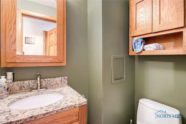 2204 Longport Dr, Maumee, OH 43537 - half bathroom featuring vanity and toilet