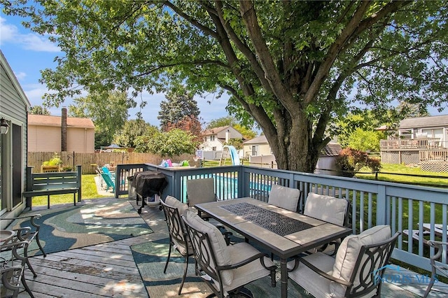 2204 Longport Dr, Maumee, OH 43537 - wooden deck featuring outdoor dining area and a fenced backyard