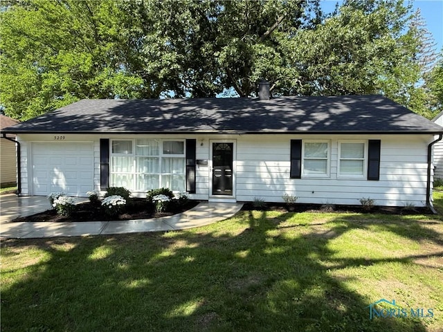 3209 Romaker Rd, Toledo, OH 43615 - single story home featuring a garage, a front lawn, and driveway