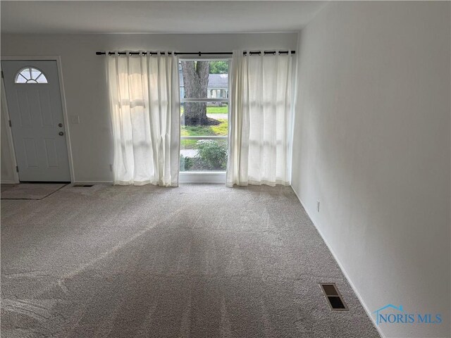 3209 Romaker Rd, Toledo, OH 43615 - unfurnished living room featuring carpet floors