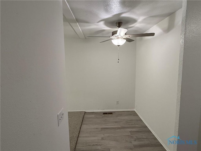 3209 Romaker Rd, Toledo, OH 43615 - spare room with a ceiling fan, wood finished floors, a textured ceiling, and a textured wall