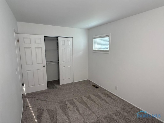 3209 Romaker Rd, Toledo, OH 43615 - unfurnished bedroom featuring carpet flooring and a closet