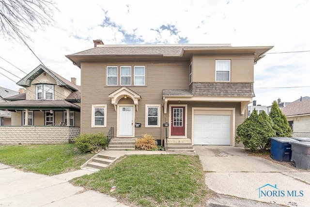 2529 Foraker Ave, Toledo, OH 43609 - view of front facade with driveway, an attached garage, a front yard, and a chimney