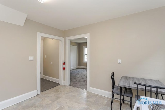 2529 Foraker Ave, Toledo, OH 43609 - dining area featuring stone finish flooring and light colored carpet