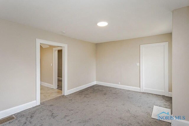 2529 Foraker Ave, Toledo, OH 43609 - empty room with carpet flooring and baseboards