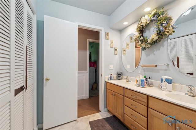 7948 Holstein Rd, Toledo, OH 43617 - full bath featuring a closet, double vanity, and recessed lighting