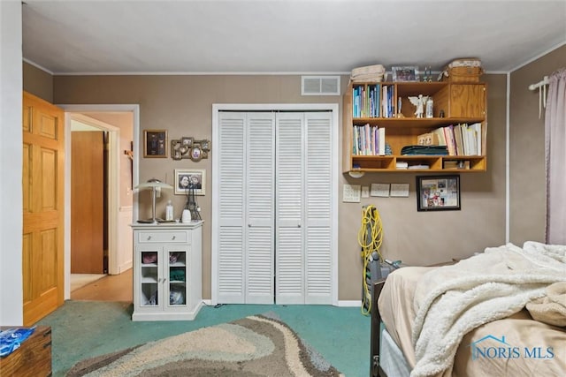 7948 Holstein Rd, Toledo, OH 43617 - carpeted bedroom with a closet and crown molding