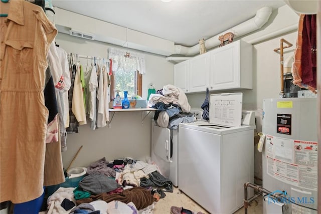 7948 Holstein Rd, Toledo, OH 43617 - washroom with gas water heater, washer and dryer, and cabinet space