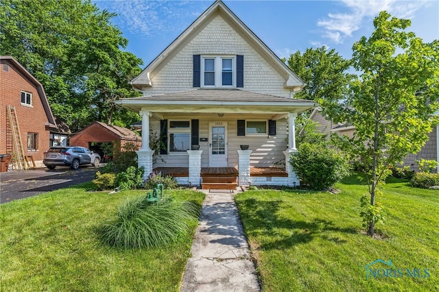 1022 E Sandusky St, Findlay, OH 45840 - view of front of home featuring a porch and a front lawn