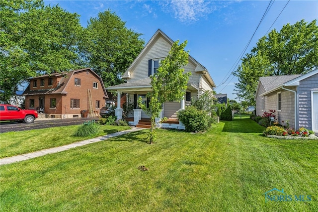 1022 E Sandusky St, Findlay, OH 45840 - view of front of home featuring a front yard and a porch