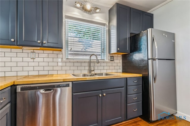 1022 E Sandusky St, Findlay, OH 45840 - kitchen featuring appliances with stainless steel finishes, butcher block counters, decorative backsplash, and dark wood finished floors