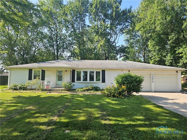 13876 Kay St, Paulding, OH 45879 - ranch-style home with driveway, an attached garage, and a front yard