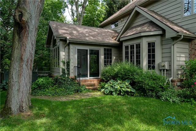 5301 River Oaks Ct, Sylvania, OH 43560 - back of property featuring a shingled roof, a yard, entry steps, and brick siding