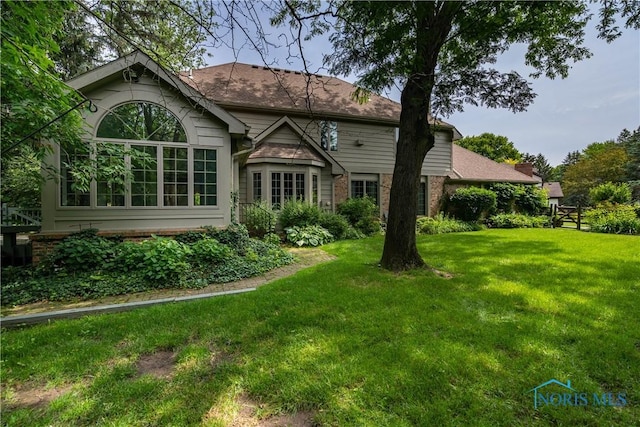 5301 River Oaks Ct, Sylvania, OH 43560 - back of house with a lawn and brick siding