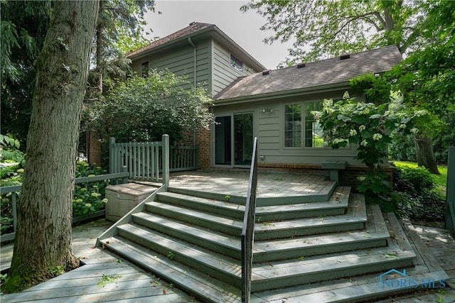 5301 River Oaks Ct, Sylvania, OH 43560 - rear view of house with a wooden deck, roof with shingles, and stairs
