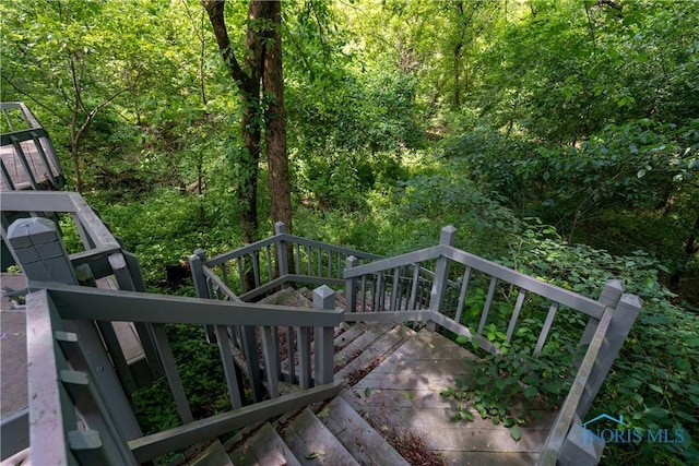 5301 River Oaks Ct, Sylvania, OH 43560 - wooden terrace with a wooded view