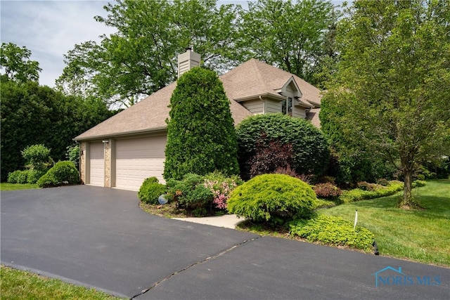 5301 River Oaks Ct, Sylvania, OH 43560 - view of home's exterior with a garage, a yard, and a chimney