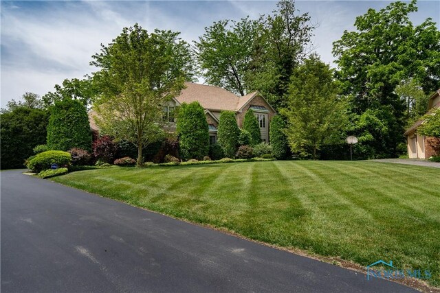 5301 River Oaks Ct, Sylvania, OH 43560 - obstructed view of property with a front yard