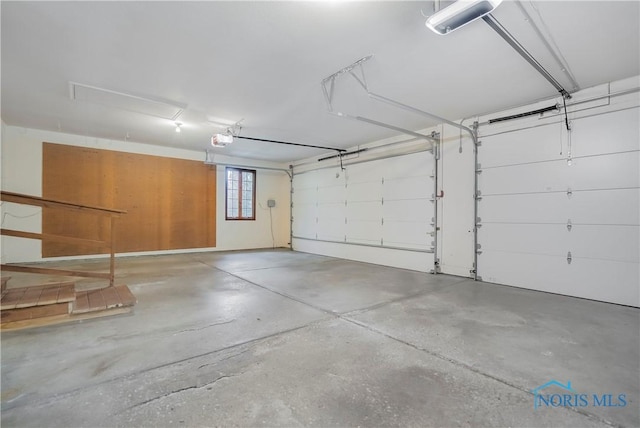 5301 River Oaks Ct, Sylvania, OH 43560 - garage featuring a garage door opener