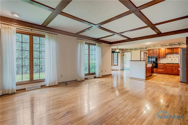 5301 River Oaks Ct, Sylvania, OH 43560 - unfurnished living room featuring coffered ceiling, healthy amount of natural light, light wood-style flooring, and beamed ceiling