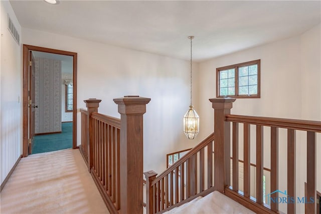 5301 River Oaks Ct, Sylvania, OH 43560 - corridor with an upstairs landing, a chandelier, and carpet floors