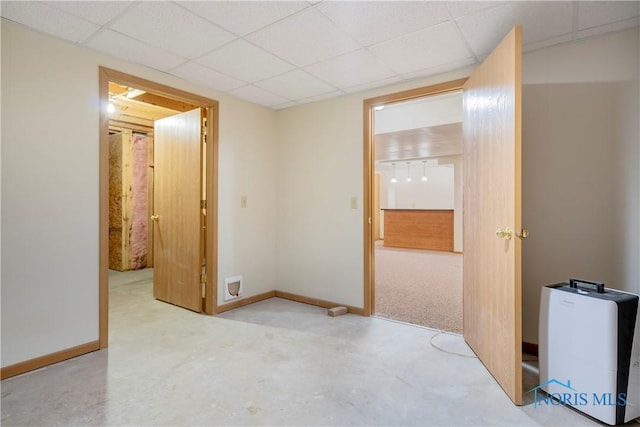 5301 River Oaks Ct, Sylvania, OH 43560 - spare room with concrete floors and a paneled ceiling