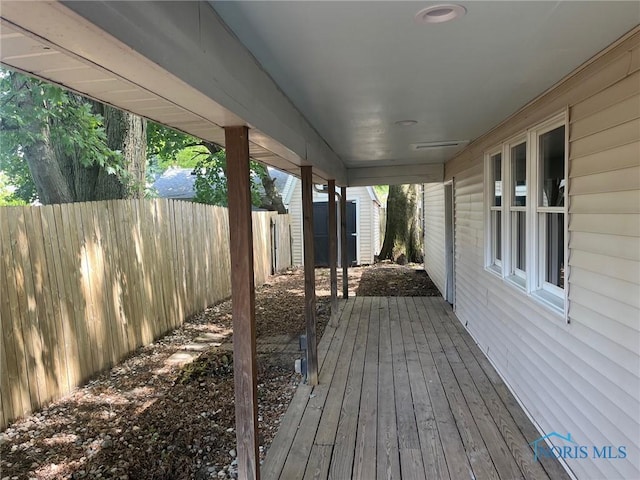 611 Greenfield Dr, Maumee, OH 43537 - wooden deck with a storage unit