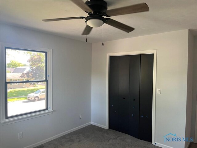 611 Greenfield Dr, Maumee, OH 43537 - unfurnished bedroom with carpet flooring, a closet, and ceiling fan