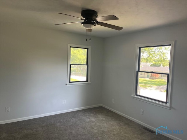 611 Greenfield Dr, Maumee, OH 43537 - carpeted spare room featuring a ceiling fan and baseboards