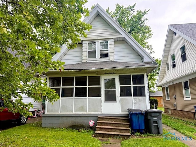 755 Dearborn Ave, Toledo, OH 43605 - rear view of property with a sunroom and a shingled roof