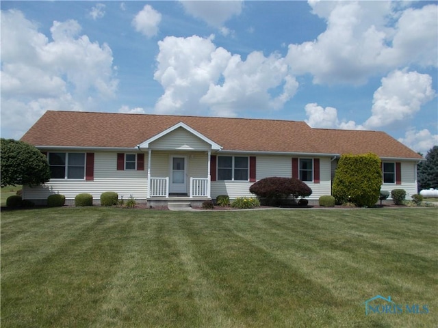 2971 County Road 12, Wauseon, OH 43567 - ranch-style home featuring a front yard, a shingled roof, and a porch