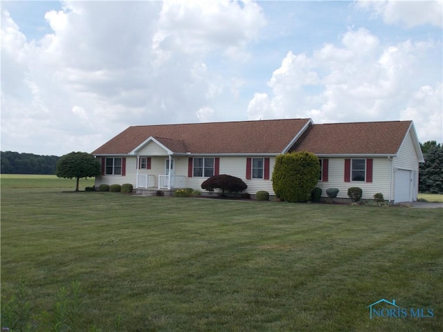 2971 County Road 12, Wauseon, OH 43567 - ranch-style house featuring a front lawn, a garage, roof with shingles, and covered porch