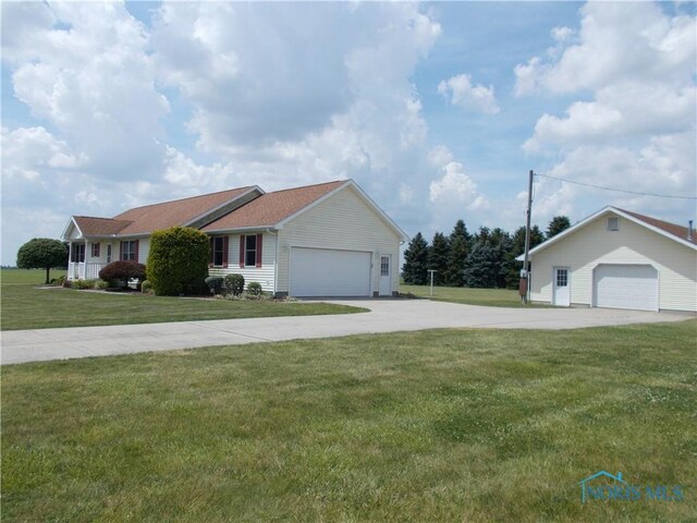2971 County Road 12, Wauseon, OH 43567 - single story home with a front yard and a detached garage
