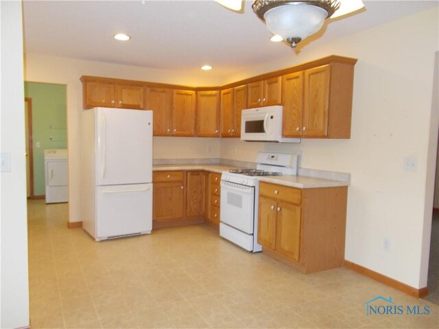 2971 County Road 12, Wauseon, OH 43567 - kitchen featuring white appliances, washer / dryer, light countertops, brown cabinets, and recessed lighting