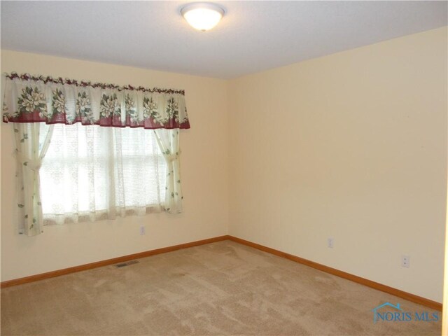 2971 County Road 12, Wauseon, OH 43567 - empty room featuring light carpet and baseboards