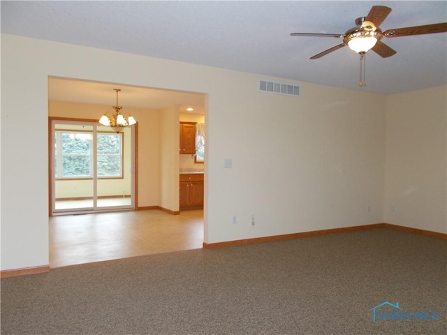 2971 County Road 12, Wauseon, OH 43567 - unfurnished room with a chandelier, a ceiling fan, and light carpet