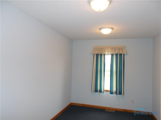 2971 County Road 12, Wauseon, OH 43567 - spare room with baseboards and carpet