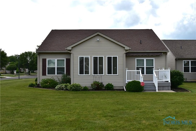 4547 Harbour Creek Ct, Maumee, OH 43537 - rear view of house featuring a yard, a deck, and roof with shingles