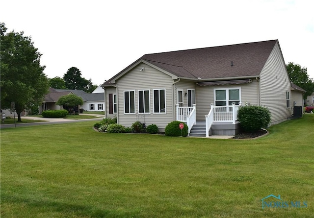 4547 Harbour Creek Ct, Maumee, OH 43537 - rear view of house with a yard and roof with shingles