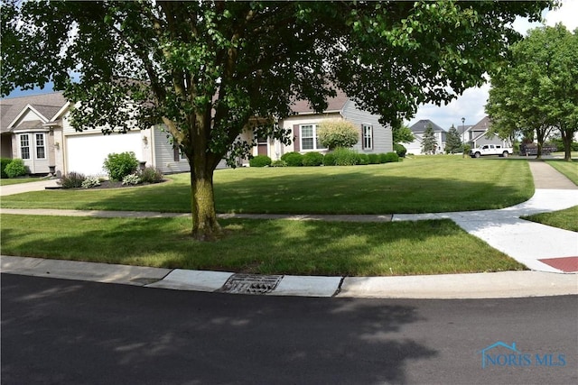 4547 Harbour Creek Ct, Maumee, OH 43537 - view of property hidden behind natural elements featuring a front lawn, a garage, and a residential view