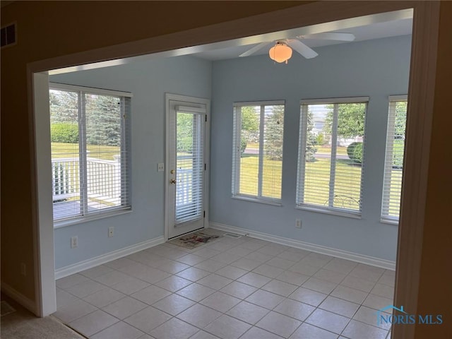 4547 Harbour Creek Ct, Maumee, OH 43537 - spare room with light tile patterned floors, plenty of natural light, and ceiling fan