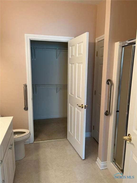4547 Harbour Creek Ct, Maumee, OH 43537 - bathroom featuring vanity, a stall shower, and a spacious closet