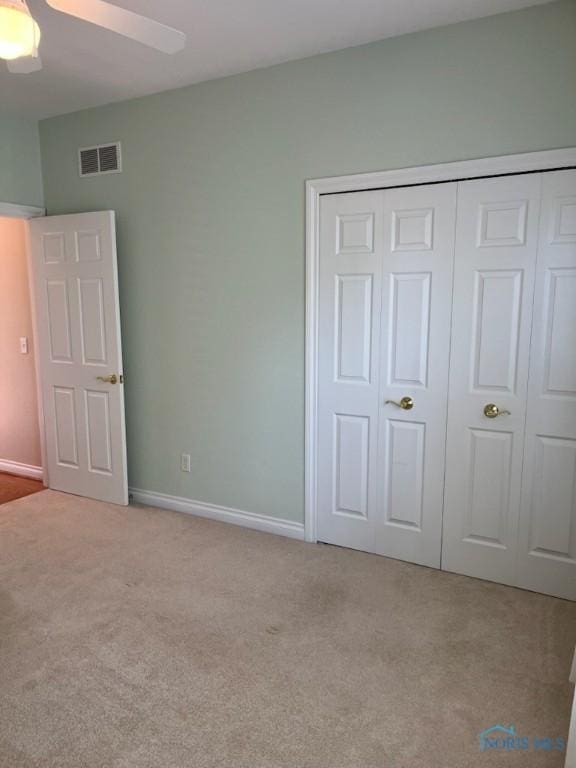 4547 Harbour Creek Ct, Maumee, OH 43537 - unfurnished bedroom featuring carpet, a closet, and a ceiling fan