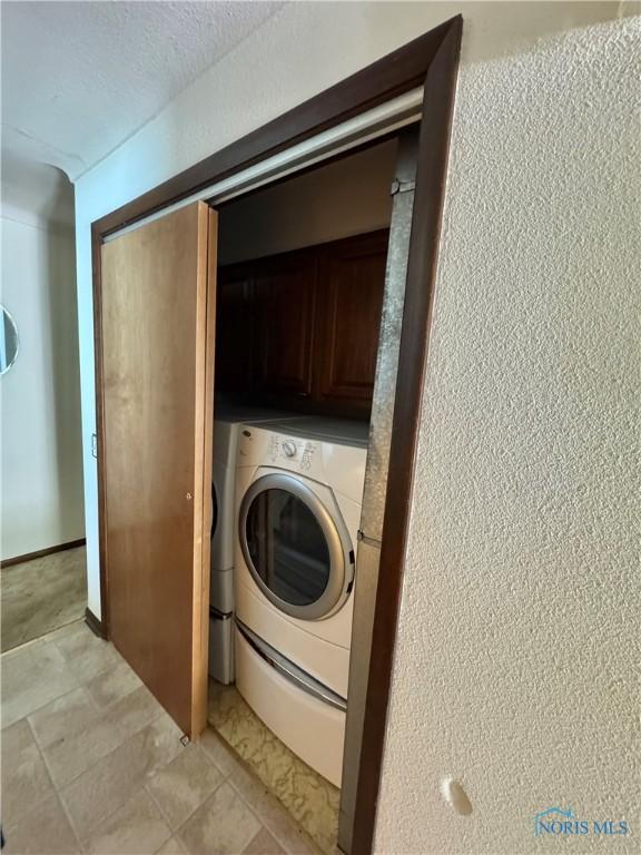 410 E Bartlow St, Deshler, OH 43516 - laundry room with washer / clothes dryer and cabinet space